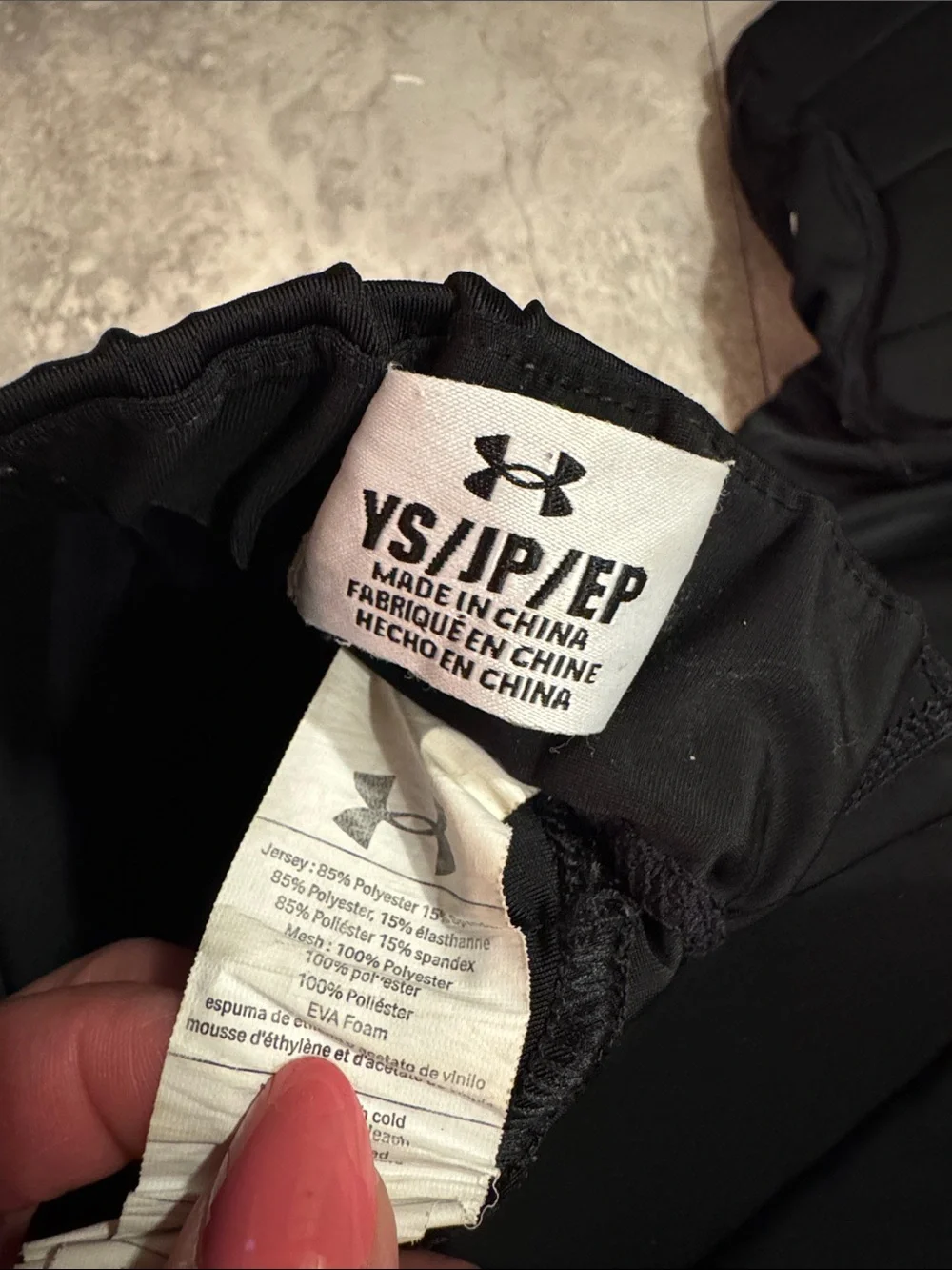Under Armour youth, small padded, black football pants